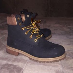 Customized black and gold timberlands.